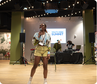 asian-man-sitting-bench-outdoors-with-laptop-listening-online-webinar